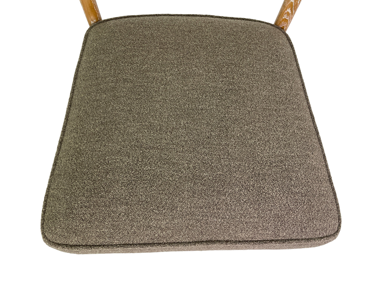 Close-up of brown fabric upholstery on Danish Modern dining chair seat