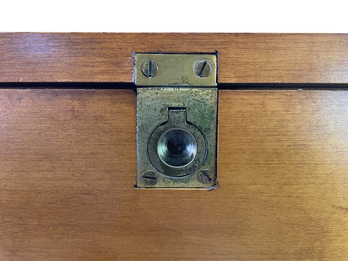 Close-up detail of original brass lock hardware on Paul McCobb Planner Group secretary cabinet in solid maple.