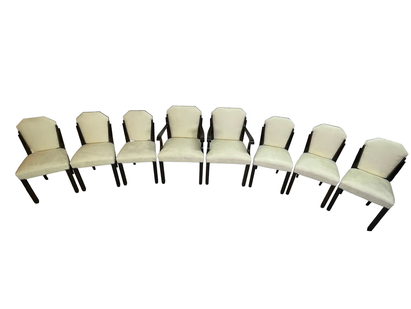 Front view of a vintage set of 8 Art Deco style dining chairs with ivory upholstery, dark mahogany frames, and nailhead trim.