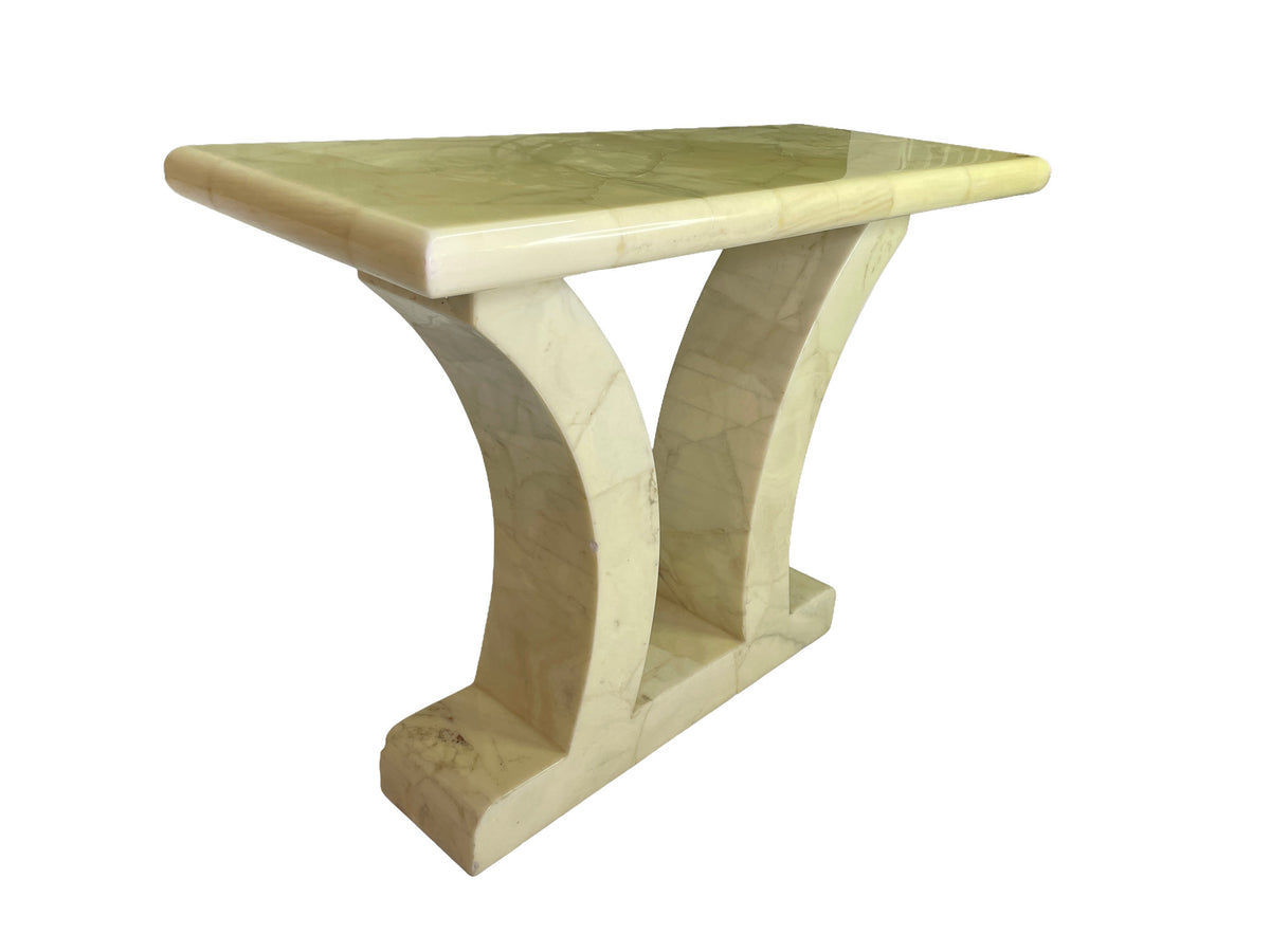 Left-angle view of the marble console showing its polished top and sculptural curved supports.