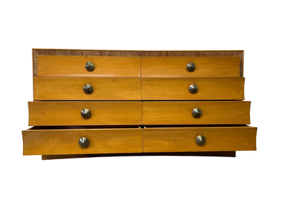 Front view of the eight-drawer dresser with alternating drawers partially open.