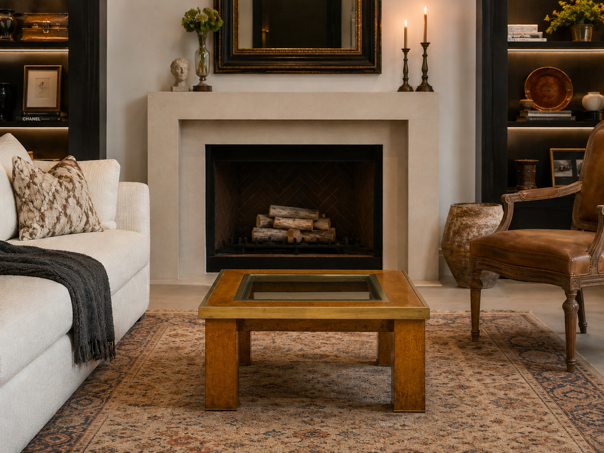 1950s olive ash burl coffee table with brass trim and recessed glass insert in a luxury designer living room