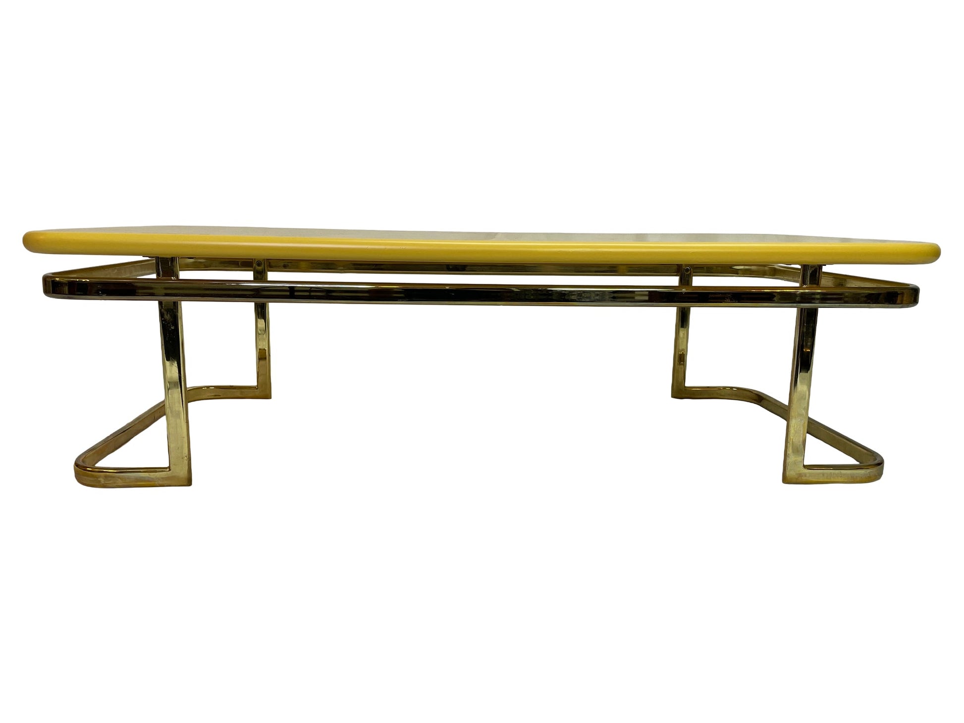 Side profile of vintage Lane Furniture coffee table with lemon yellow lacquered top and brass-tone metal base.