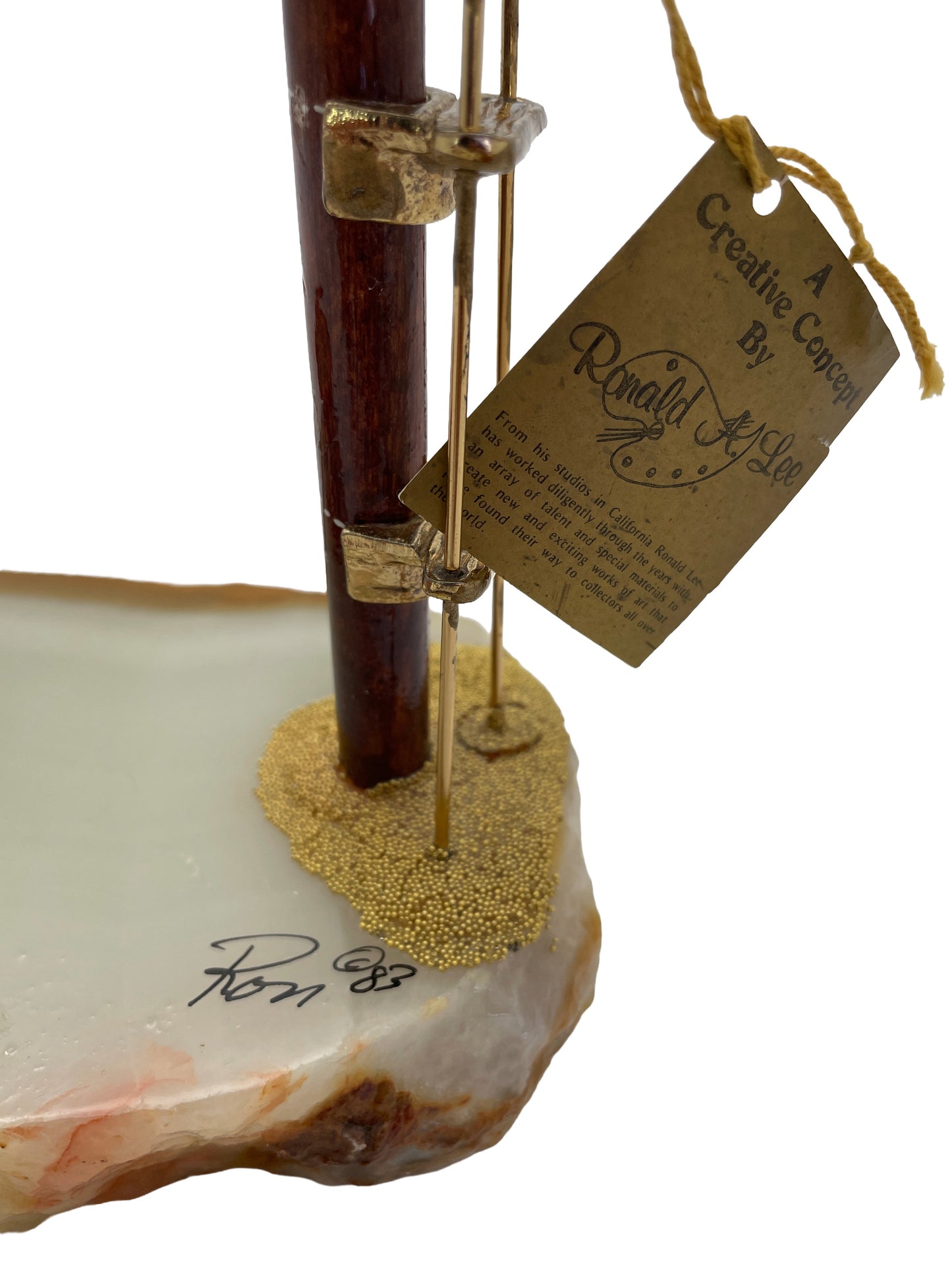 Close-up of the Ronald A. Lee signature dated 1983 with original artist label on the vintage clown high diver sculpture.