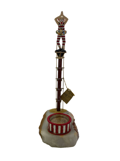 Front view of a signed Ronald A. Lee clown high diver sculpture with 24K gold-plated accents and natural onyx base, dated 1983.