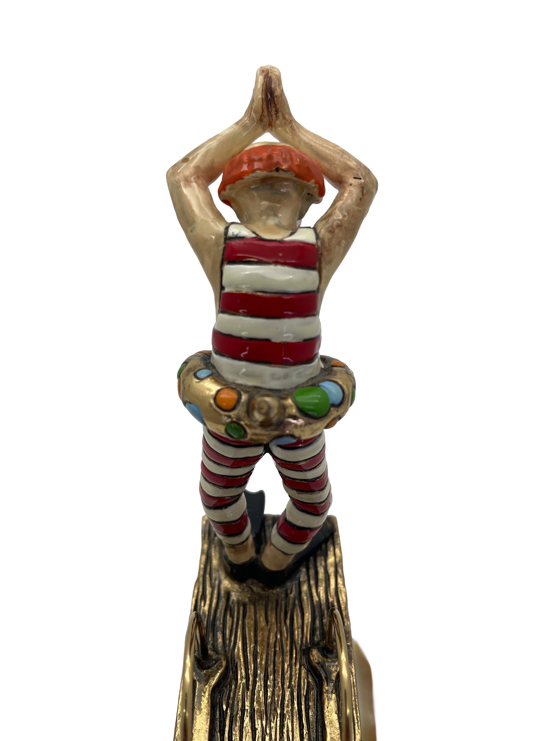 Rear close-up of the hand-painted clown figure standing on the diving platform with colorful gold-plated float.
