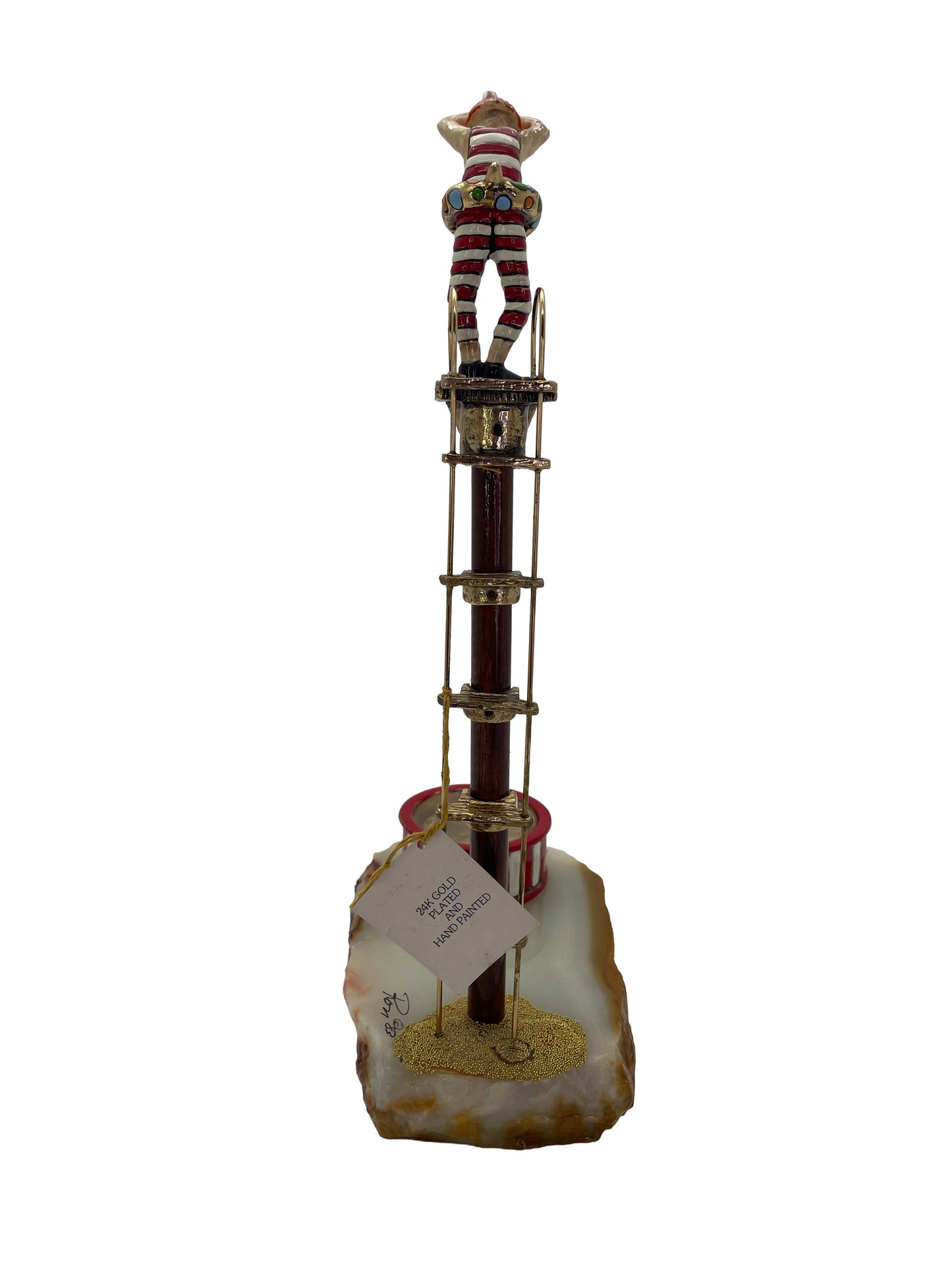 Rear view of the signed Ronald A. Lee clown high diver sculpture showing the original 24K gold plated and hand-painted label.