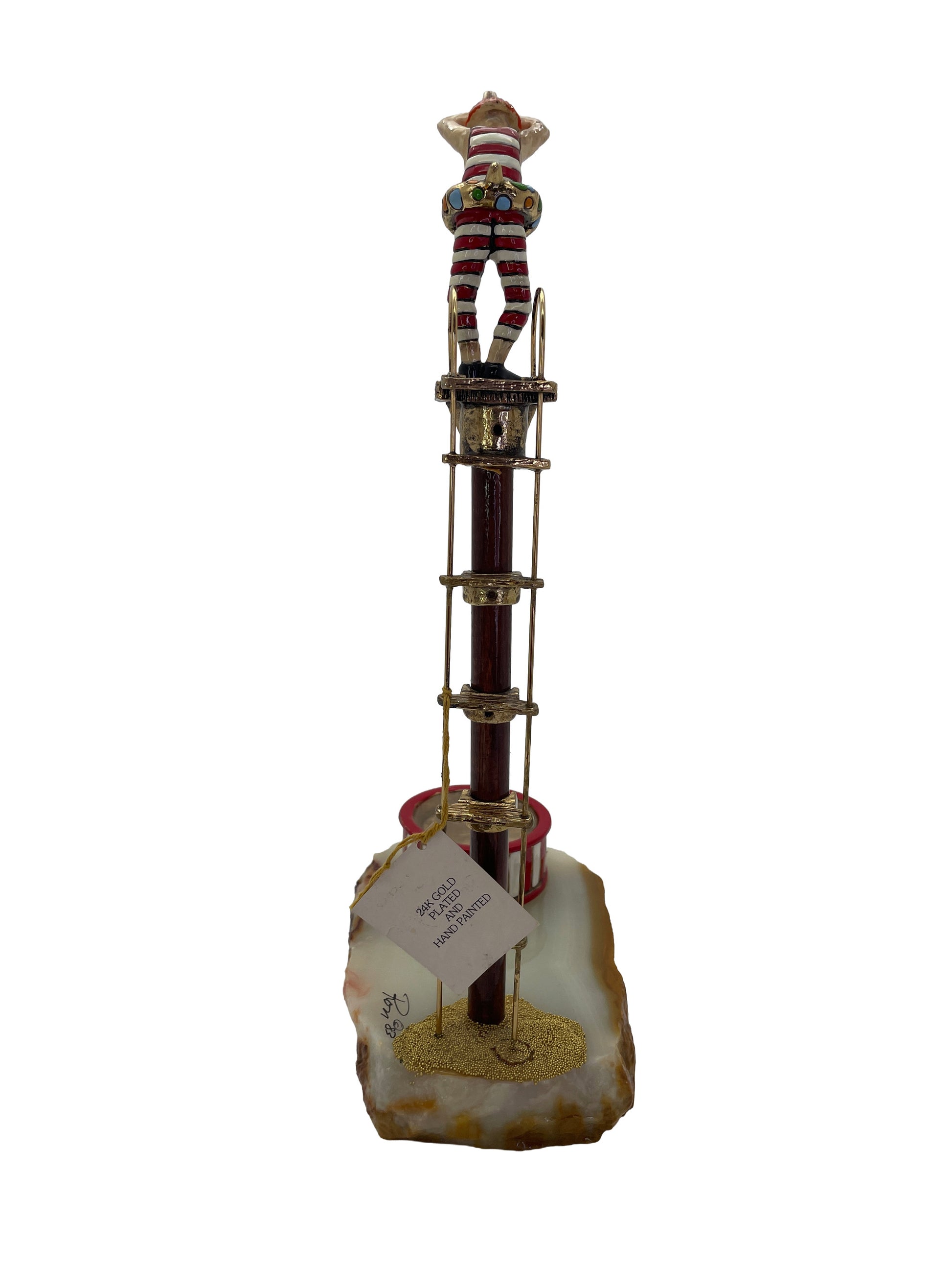 Rear view of the signed Ronald A. Lee clown high diver sculpture showing the original 24K gold plated and hand-painted label.