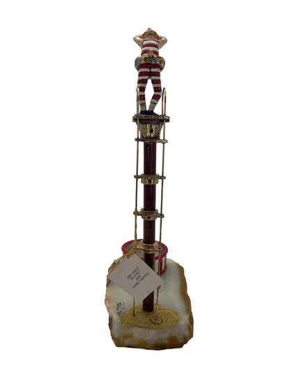Rear view of the signed Ronald A. Lee clown high diver sculpture showing the original 24K gold plated and hand-painted label.