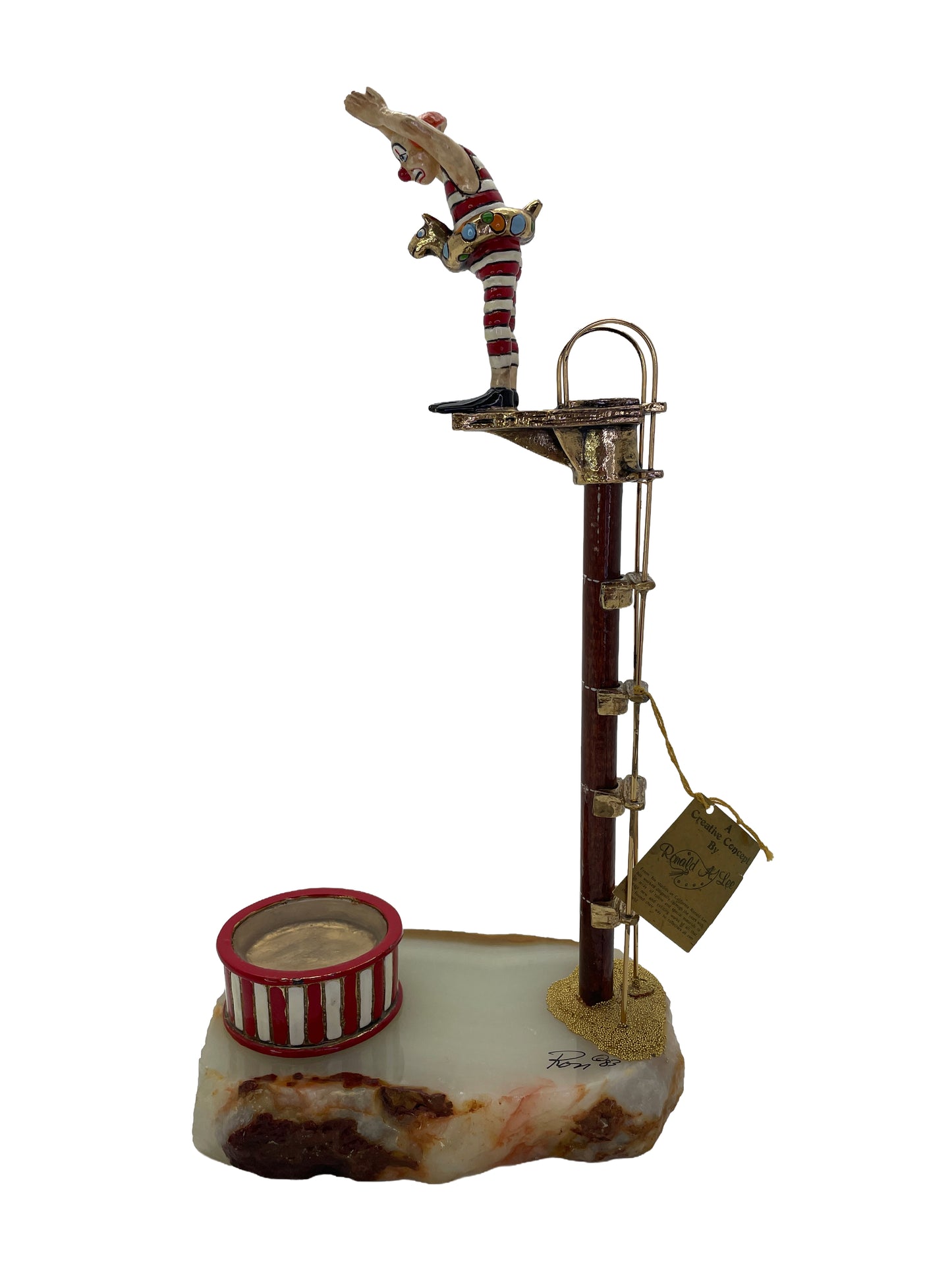Signed Ronald A. Lee hand-painted clown high diver sculpture with 24K gold-plated accents on a natural onyx base, dated 1983.