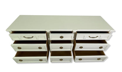 Front elevated view of the nine open drawers and clean wood interiors of the American of Martinsville dresser