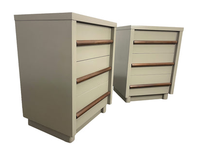 Angled view of vintage American of Martinsville nightstands with chestnut gray lacquer finish and walnut drawer pulls.