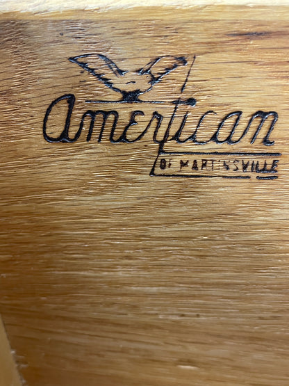 Close-up of the American of Martinsville manufacturer stamp inside a Mid-Century Modern nightstand drawer.