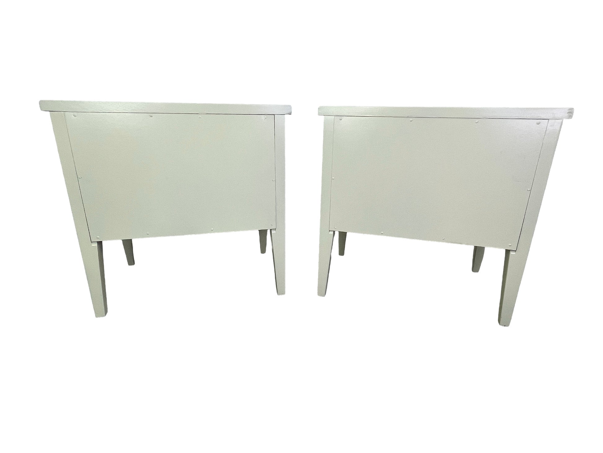 Back side view of American of Martinsville nightstands with tapered legs and fluted detailing
