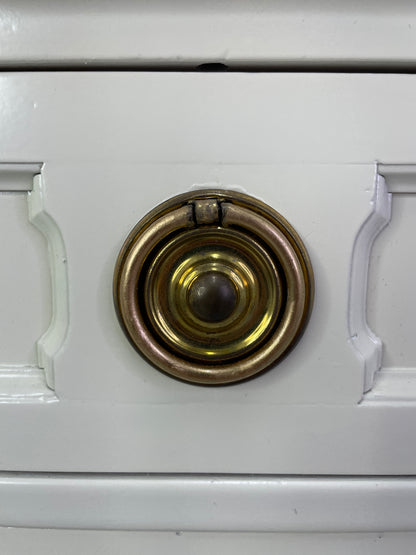 Close-up of original brass hardware on American of Martinsville nightstand with light patina
