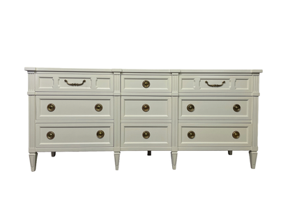 Vintage American of Martinsville nine-drawer triple dresser in warm off-white lacquer, front view