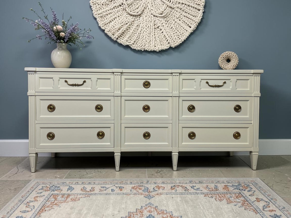American of Martinsville warm off-white lacquered triple dresser styled in a refined mineral-blue interior