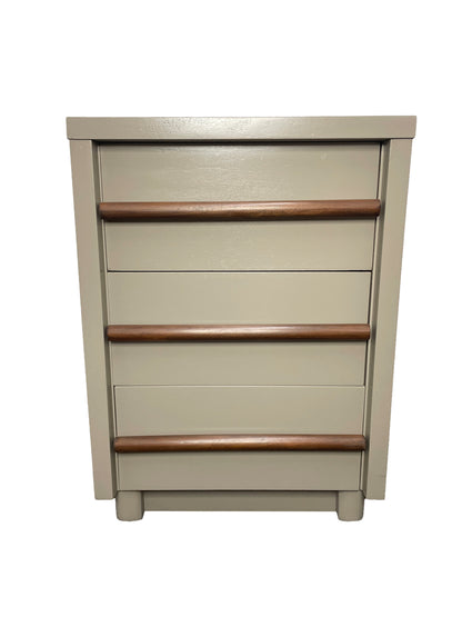 Front view of a restored American of Martinsville three-drawer nightstand with walnut pulls and chestnut gray lacquer finish.