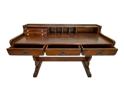 Antique Victorian pine writing desk showing fully extended drawers, storage compartments, and original brass drawer pulls.