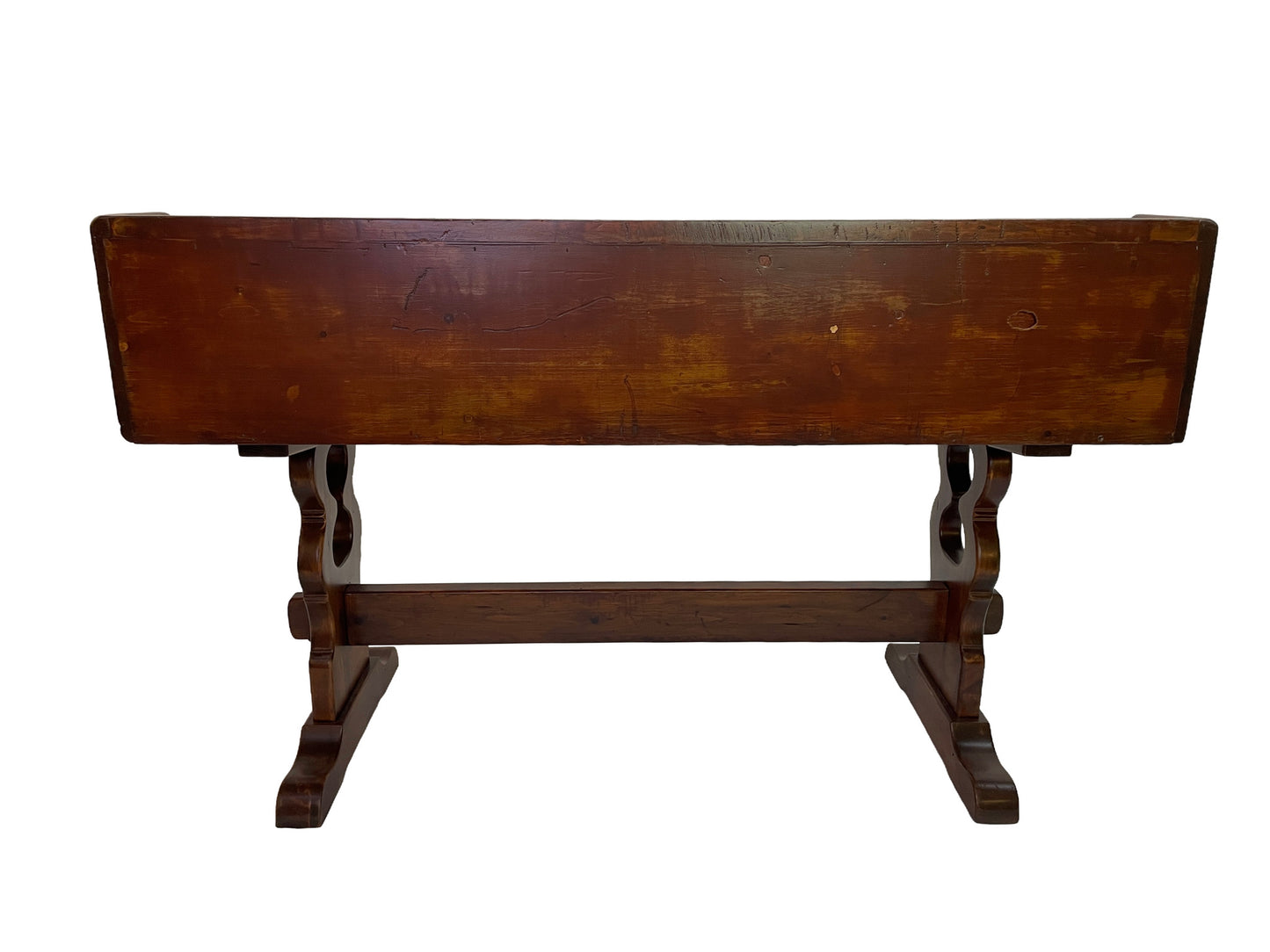 Rear view of an antique Victorian solid pine writing desk with trestle base and original aged patina.