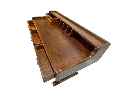 Antique Victorian solid pine writing desk showing open drawers, organizer compartments, porcelain knobs, and original brass hardware.