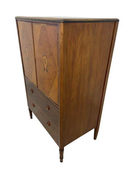Angled right side view of vintage Sligh cabinet highlighting wood grain and structure