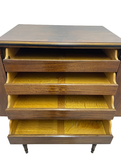 Close-up of drawer interiors in Sligh cabinet showing wood grain and storage space