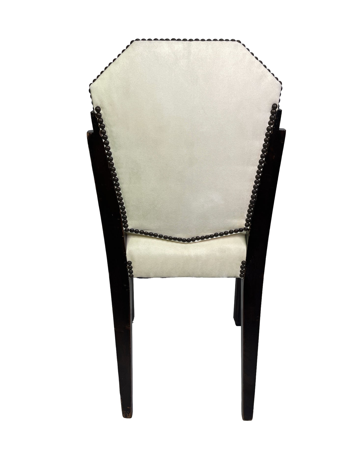Rear view of a vintage Art Deco style dining chair showing ivory upholstery, dark mahogany frame, and decorative nailhead trim.