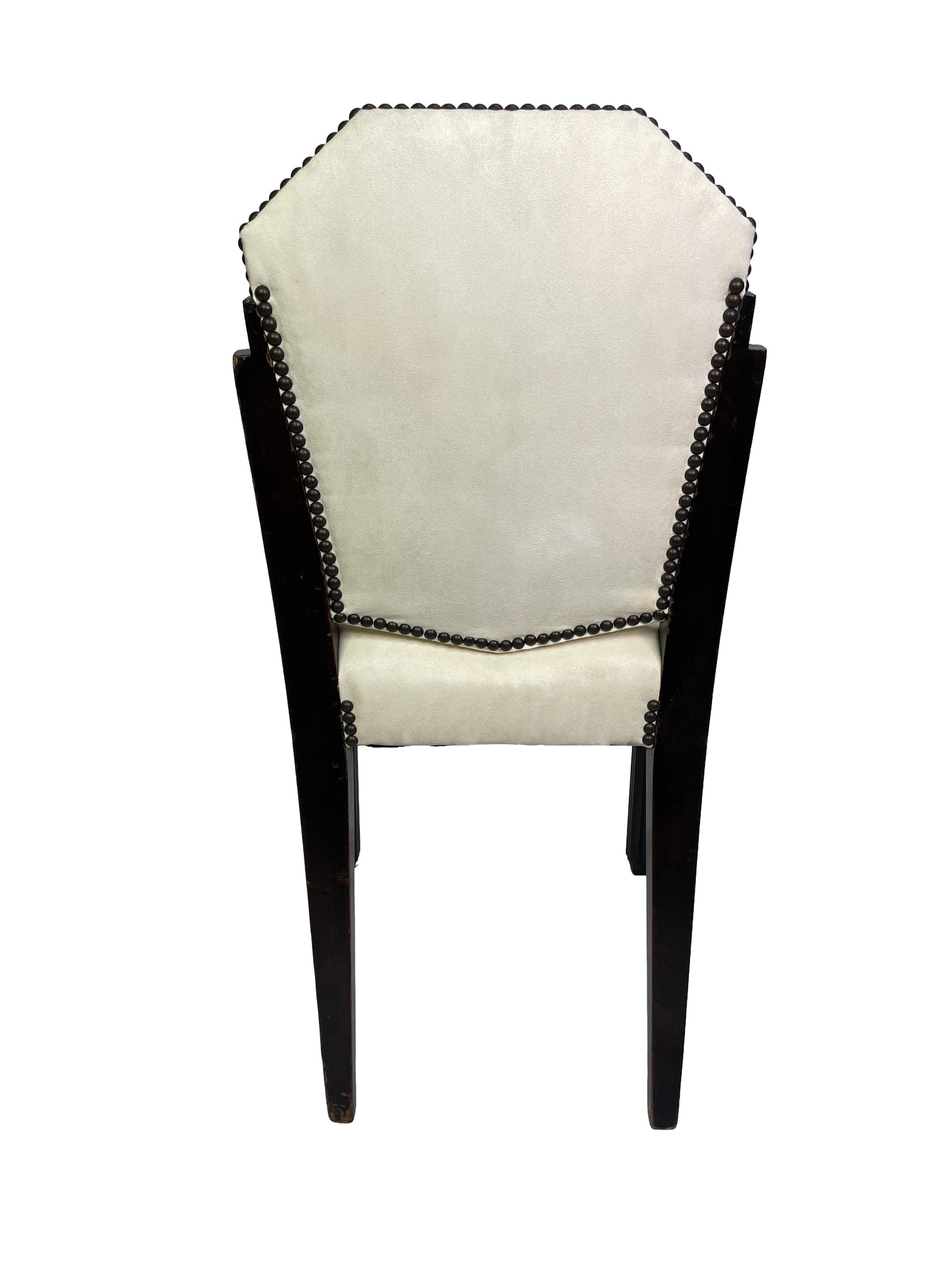 Rear view of a vintage Art Deco style dining chair showing ivory upholstery, dark mahogany frame, and decorative nailhead trim.
