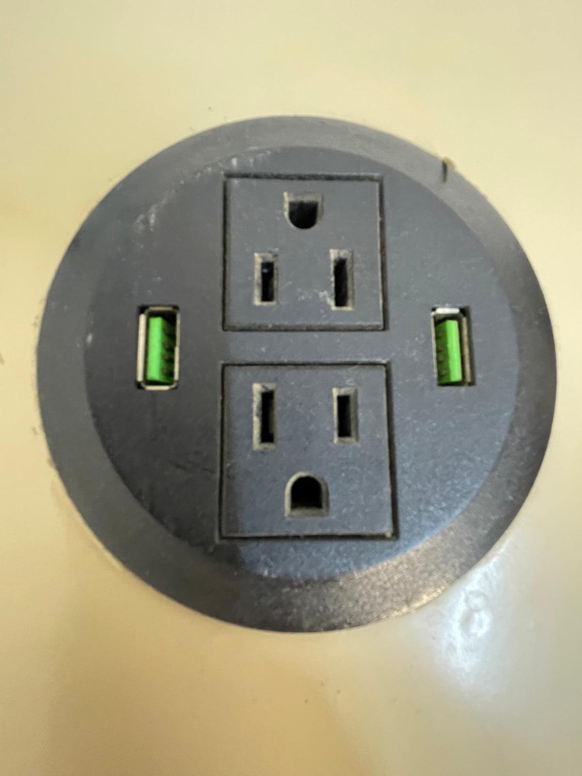 Built-in power outlet and USB charging ports integrated into the side table of a custom sofa.