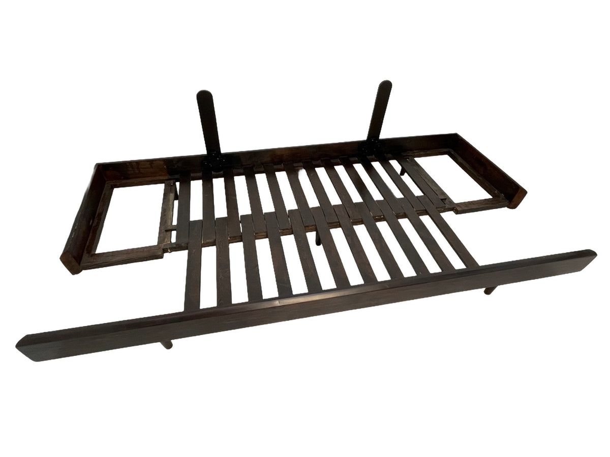 Expandable platform mechanism beneath a custom convertible sofa showing sleeper bed construction.