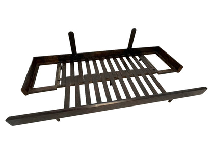 Expandable platform mechanism beneath a custom convertible sofa showing sleeper bed construction.