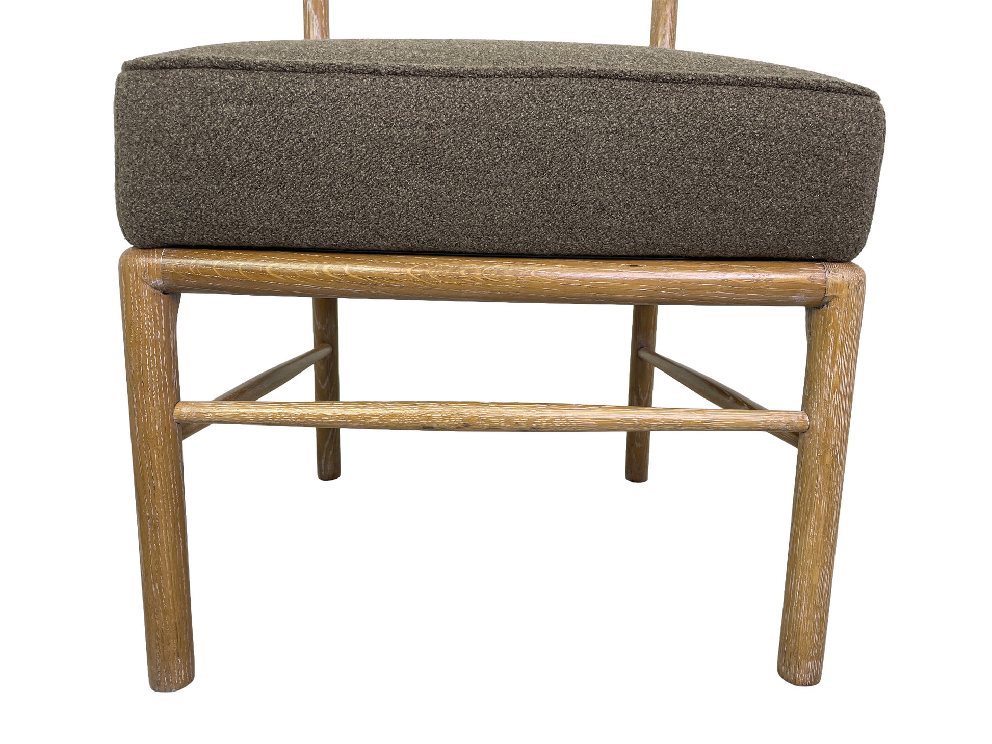 Detail of cerused oak wood grain on Danish Modern dining chair frame legs
