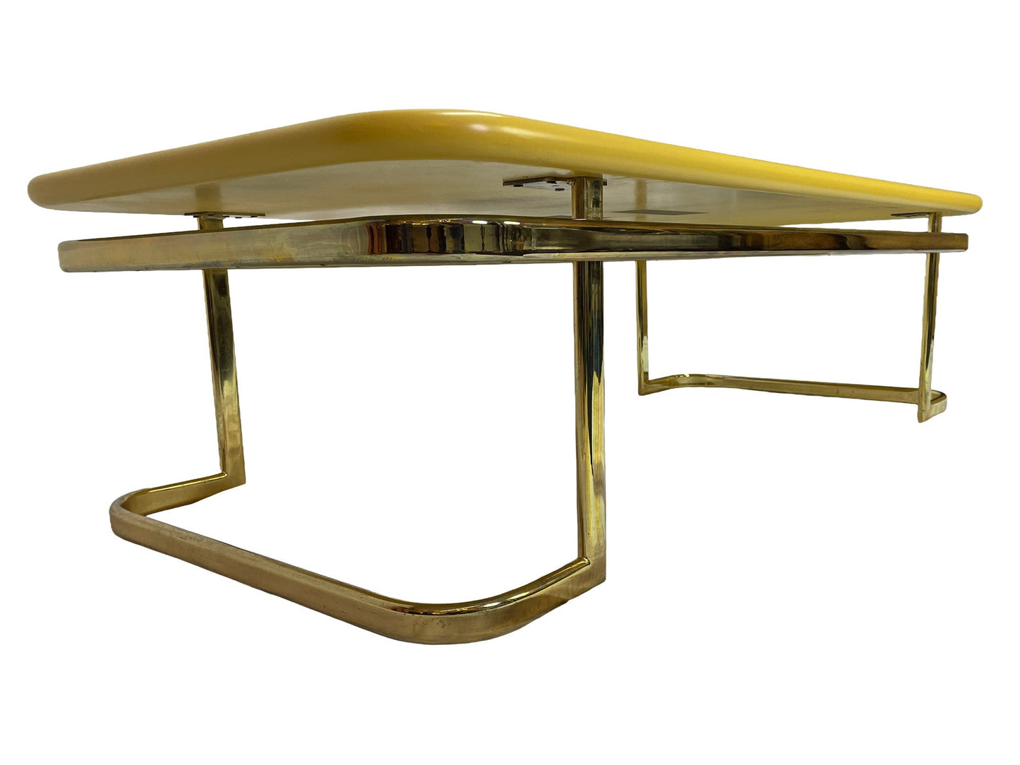 Low side profile of 1970s Lane coffee table featuring rounded yellow lacquer top and brass-tone frame.