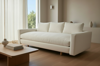 Luxury contemporary white upholstered lounge daybed with deep seating and custom sculptural silhouette lifestyle environment