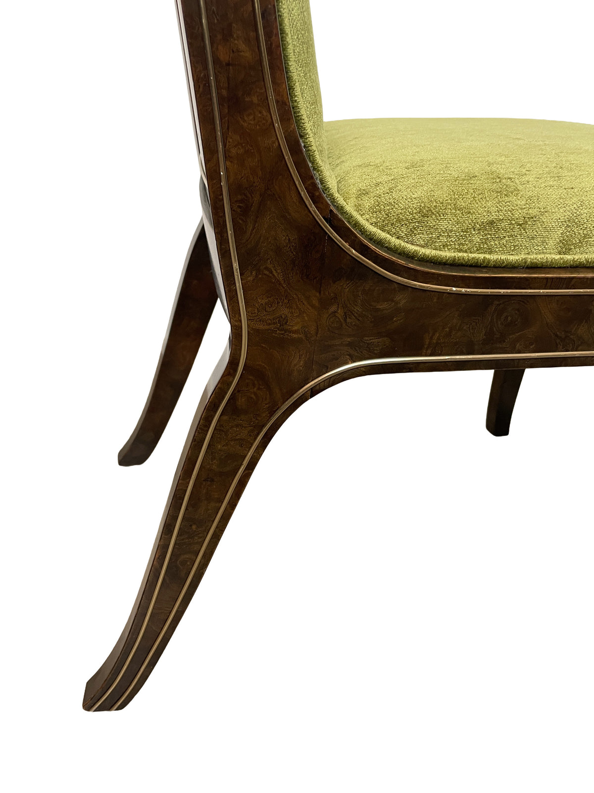 Close-up of the curved burl wood chair frame and brass-tone inlay