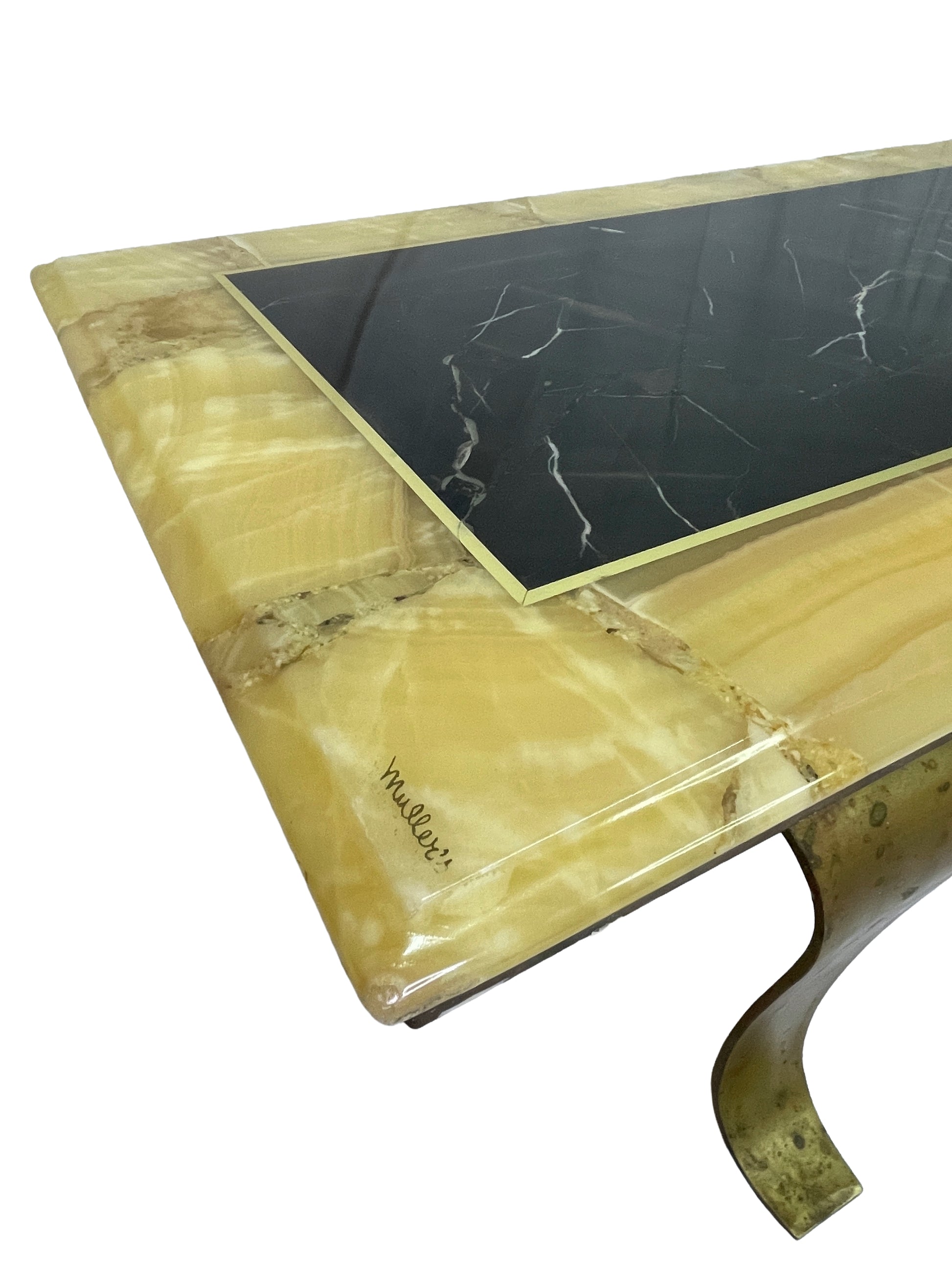 Detail of signed Muller onyx coffee table showing black and yellow stone surface