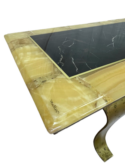 Detail of signed Muller onyx coffee table showing black and yellow stone surface