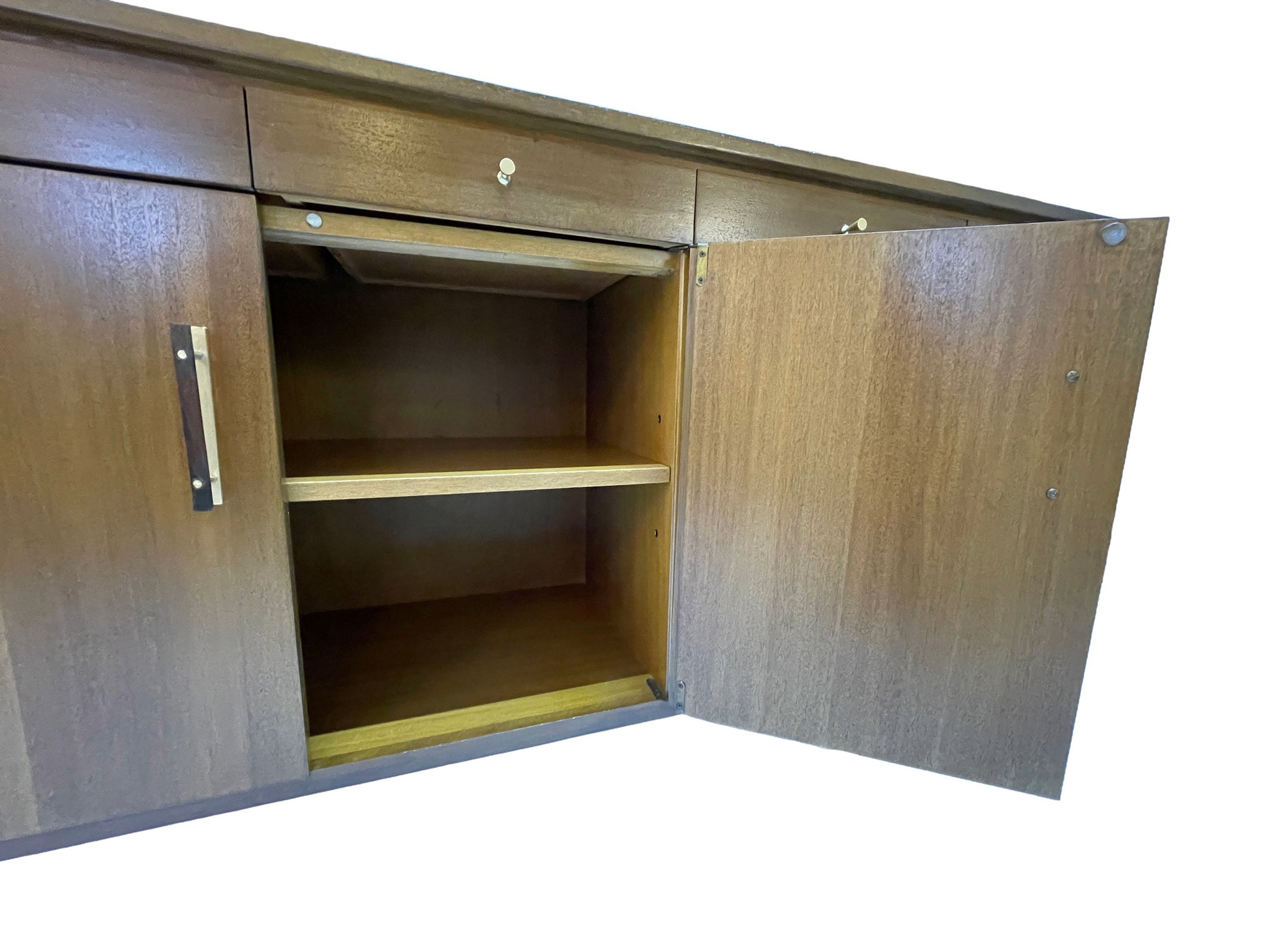 Cabinet storage detail of a Paul McCobb for Calvin Group ribbon mahogany credenza showing adjustable shelving and clean restored interior construction.
