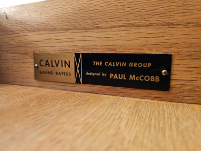 Original Calvin Group maker’s label identifying Paul McCobb as designer, mounted inside a restored ribbon mahogany credenza manufactured in Grand Rapids, Michigan.