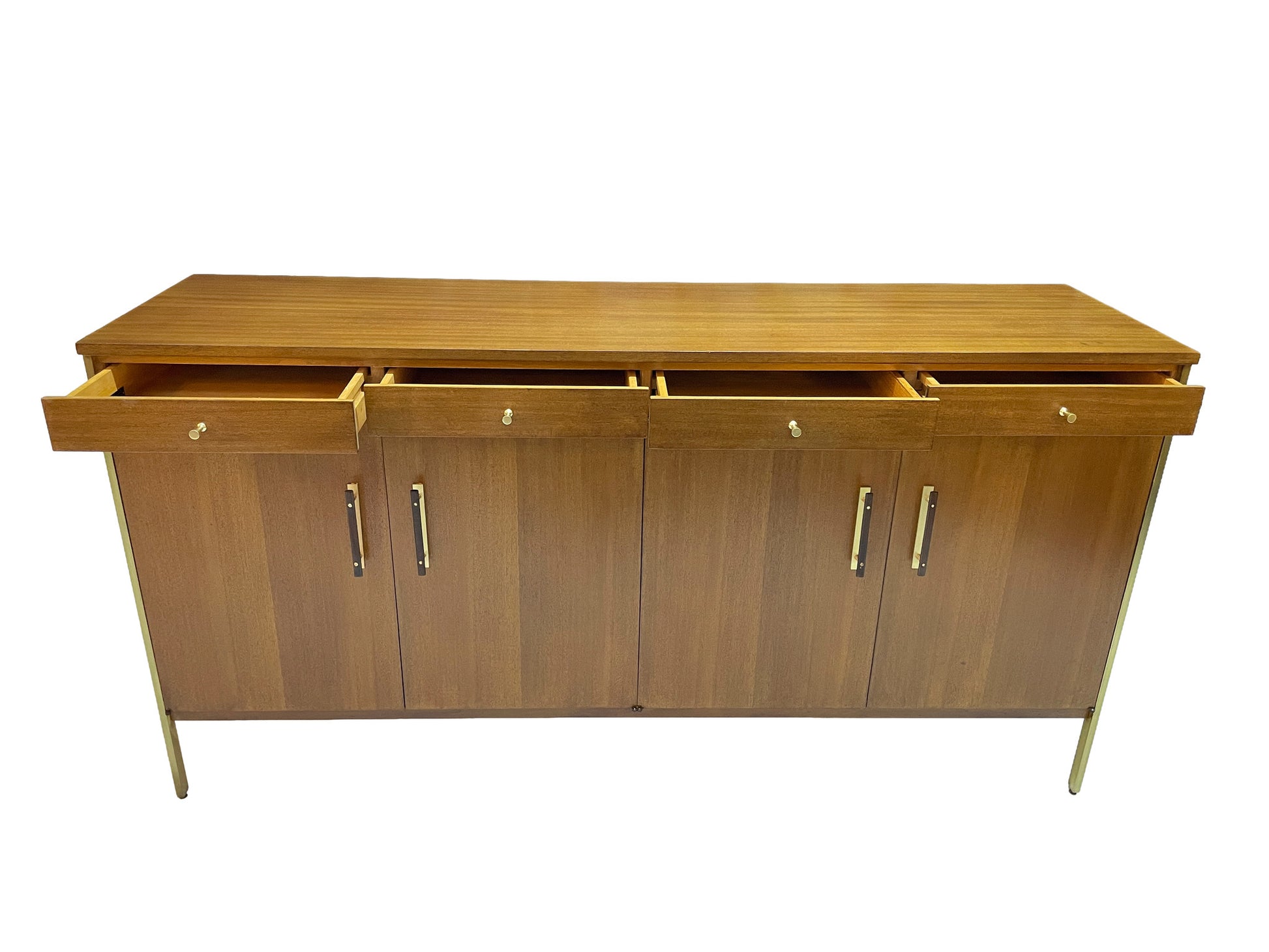 Paul McCobb Calvin Group credenza with all four drawers open, showing interior storage and restored ribbon mahogany construction with brass hardware.
