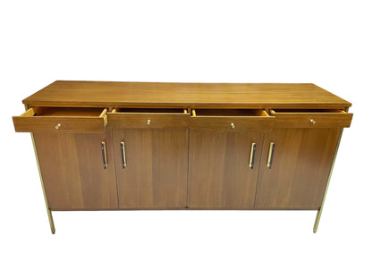 Paul McCobb Calvin Group credenza with all four drawers open, showing interior storage and restored ribbon mahogany construction with brass hardware.