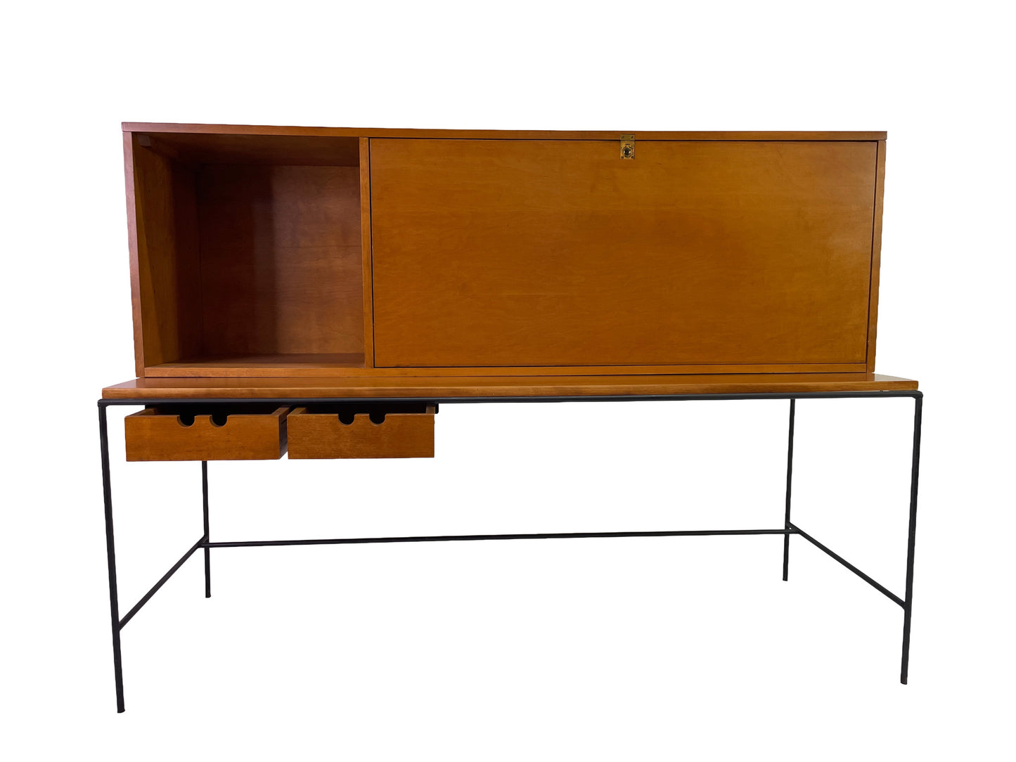 Paul McCobb Planner Group secretary desk by Winchendon Furniture with closed sliding cabinet, maple construction, black iron frame, and exposed drawers, circa 1950s.