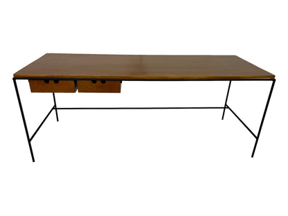 Paul McCobb Planner Group writing table in solid maple with minimalist black iron base and floating drawers, mid-century modern design for Winchendon Furniture.