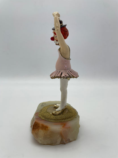 Left side profile of a vintage Ron Lee ballerina clown sculpture with hand-painted finish and gold-plated details.
