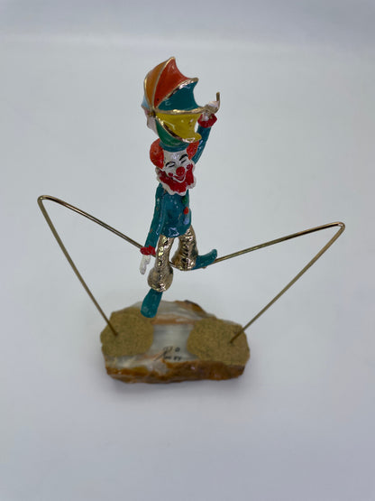 Elevated front angle showing the colorful umbrella and balancing pose of a Ron Lee clown sculpture.