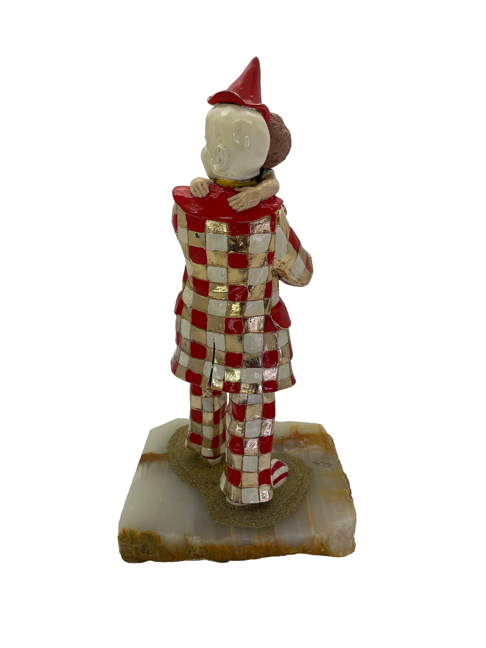 Rear view of a signed Ron Lee clown sculpture with hand-painted enamel, 24K gold-plated accents, and a natural onyx base, dated 1985.
