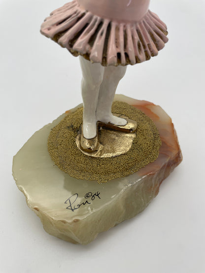 Close-up of the signed natural onyx base on a vintage Ron Lee ballerina clown sculpture dated 1984.