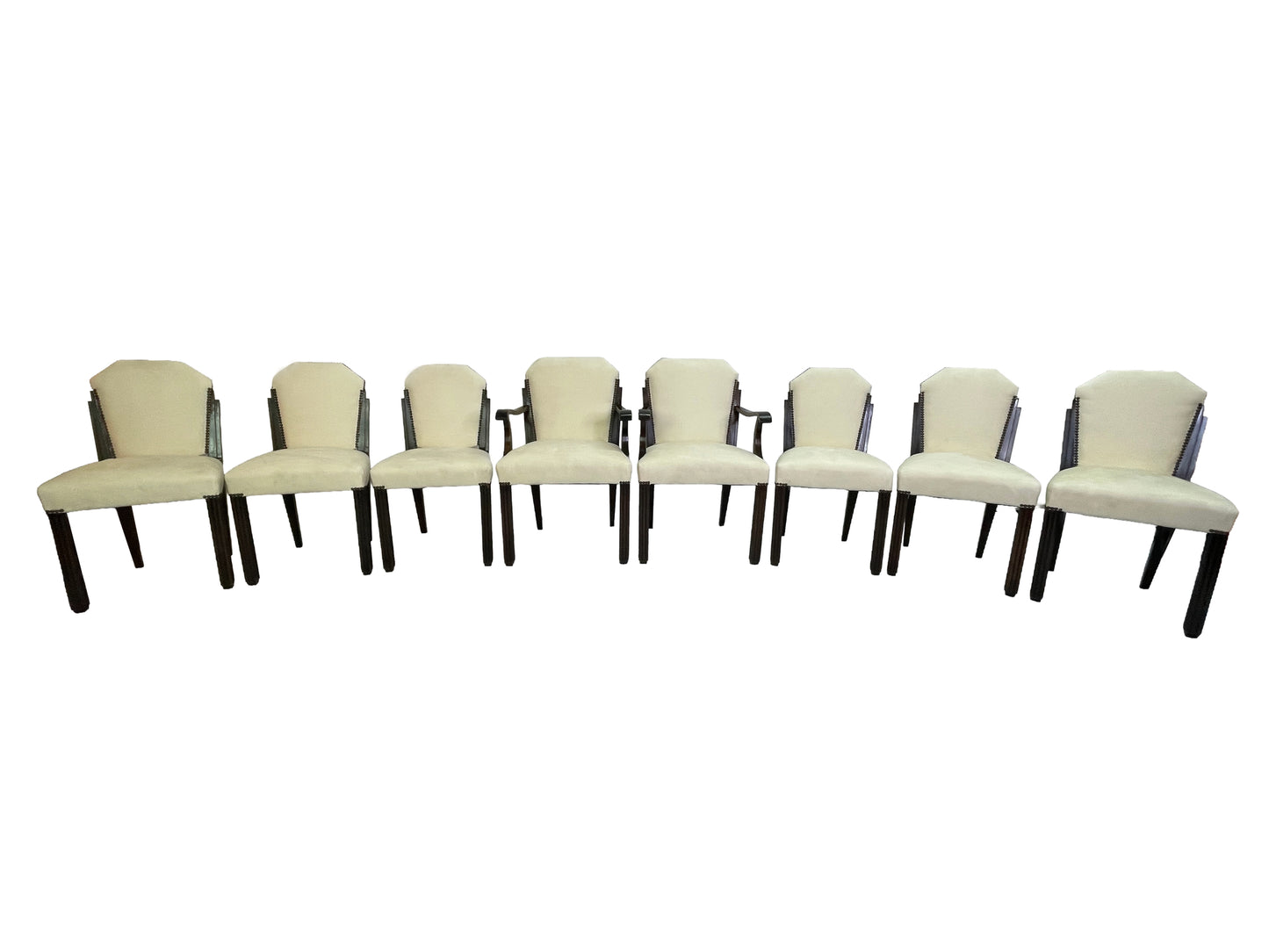 Set of 8 Art Deco style dining chairs with ivory upholstery and dark mahogany frames including two armchairs and six side chairs.