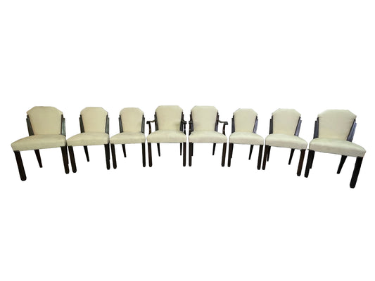 Set of 8 Art Deco style dining chairs with ivory upholstery and dark mahogany frames including two armchairs and six side chairs.